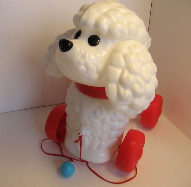 Игрушка собачка на поводке.