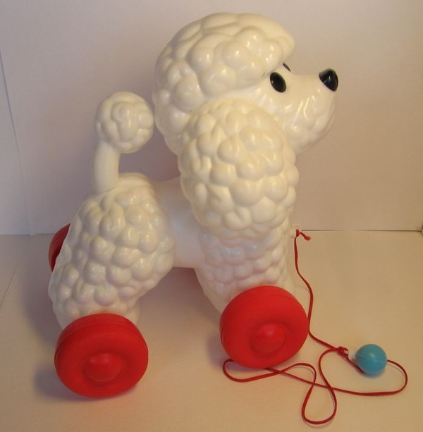 Игрушка собачка на поводке.