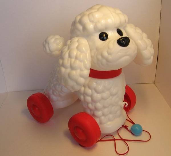 Игрушка собачка на поводке.