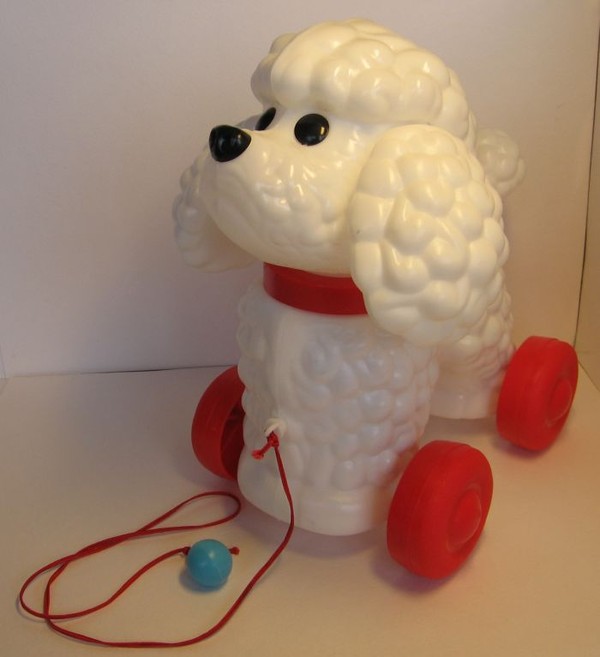 Игрушка собачка на поводке.