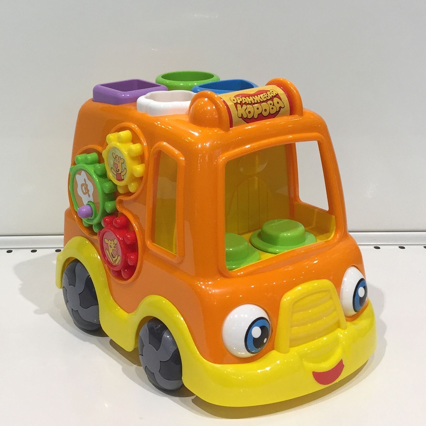 Игрушка машинка с вращением глазок - развивающий центр моторики для малышей оранжевая - 25 см