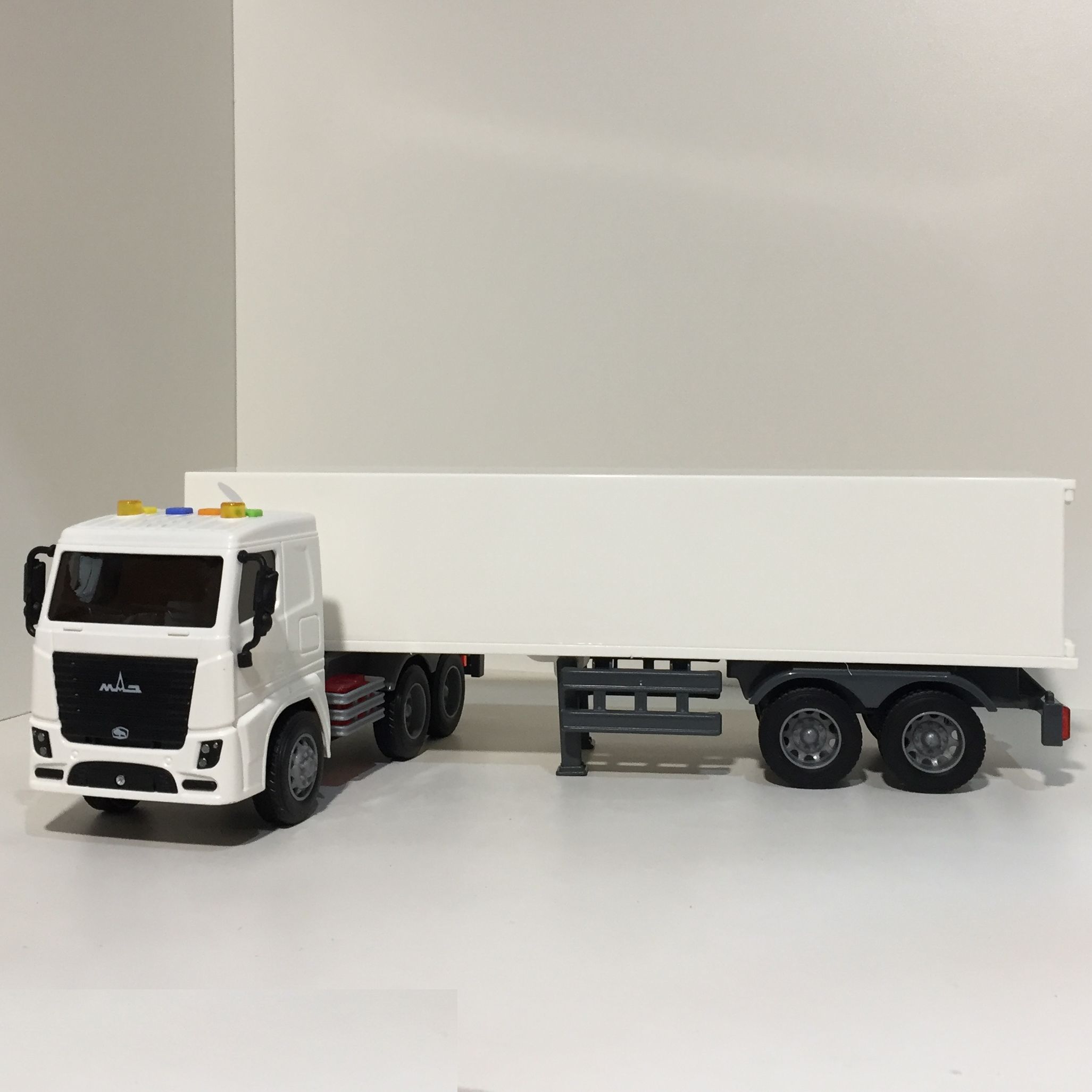 Игрушка фура дальнобойщик МАЗ - 47 см тягач с фургоном  Полесье  инерция, свет, звук белая Игрушка фура дальнобойщик МАЗ - 47 см тягач с фургоном  Полесье  инерция, свет, звук белая